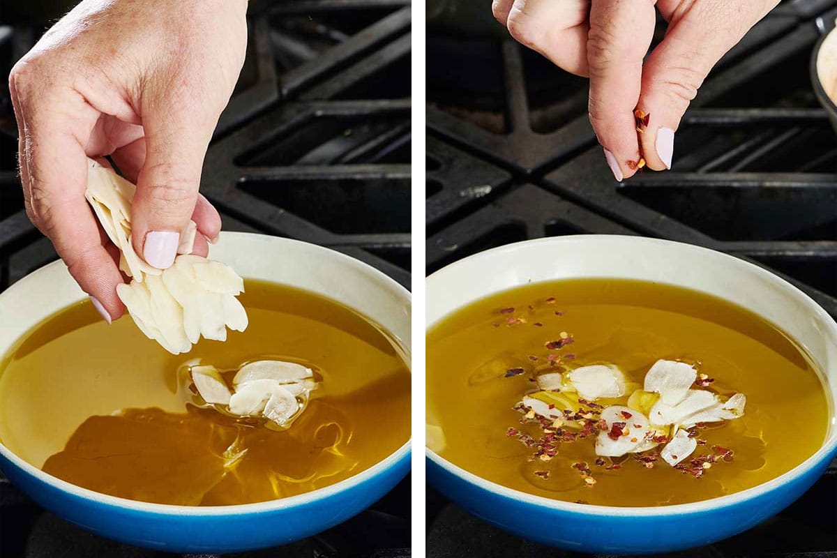 Making garlic oil with red pepper in small pan on stove.