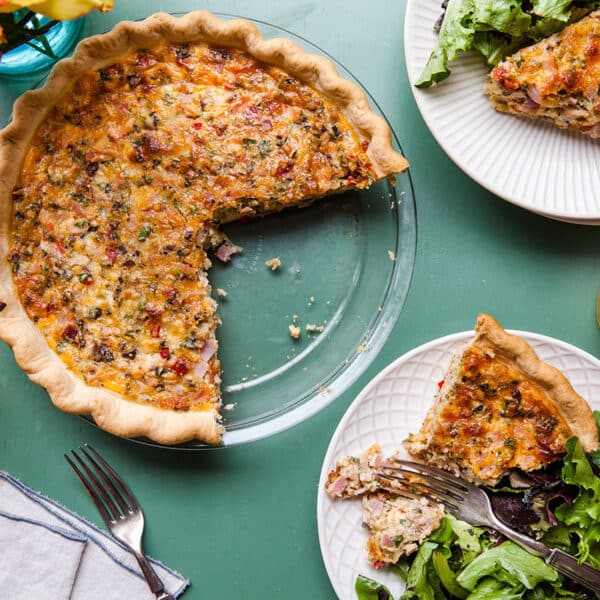 Serving Ham and Cheese quiche on table.