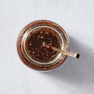 Sun-Dried Tomato Pesto in glass jar with spoon