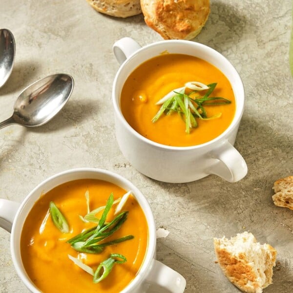 Bowls of Vegan Butternut Squash and Apple Soup on table