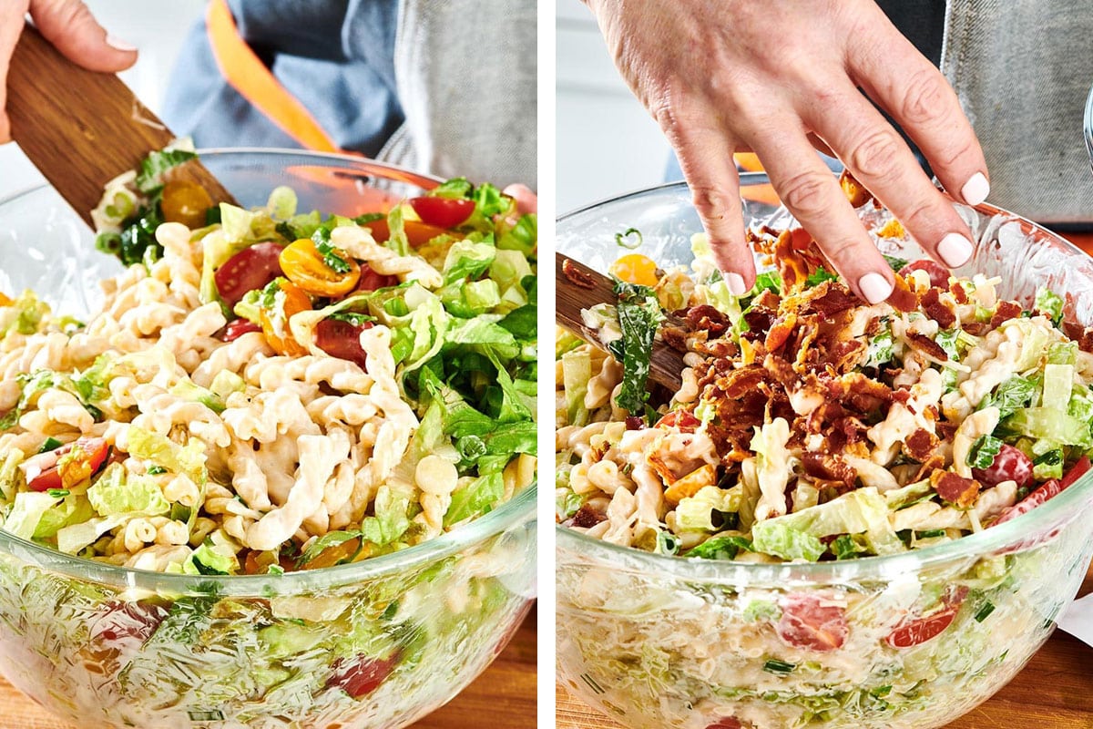 Tossing vegetables and bacon into pasta salad.