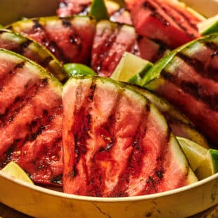 Cookout serving platter filled with grilled watermelon slices.