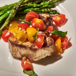 Grilled tuna with tomato salsa and asparagus side.