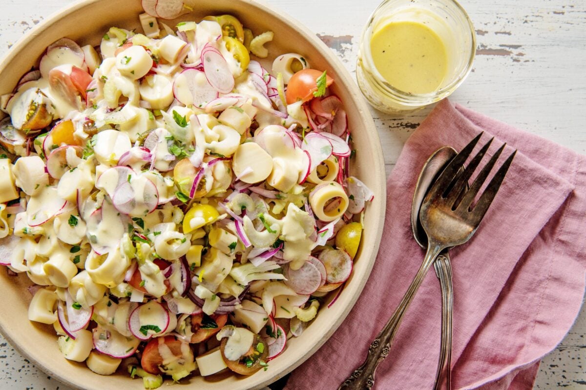Hearts of Palm Salad in bowl on table with napkin and silverware.