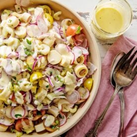 Hearts of Palm Salad in bowl on table with napkin and silverware.