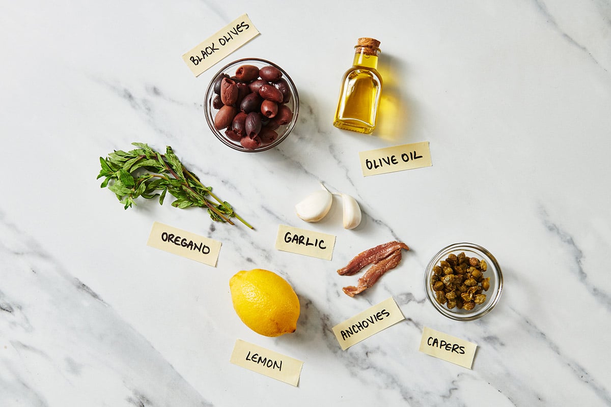 Black olives, herbs, lemon, anchovies, and other tapenade ingredients.