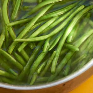 Blanching green beans in large pot of water.