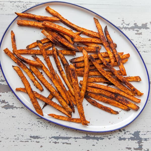 Sweet potato fries on white plate.