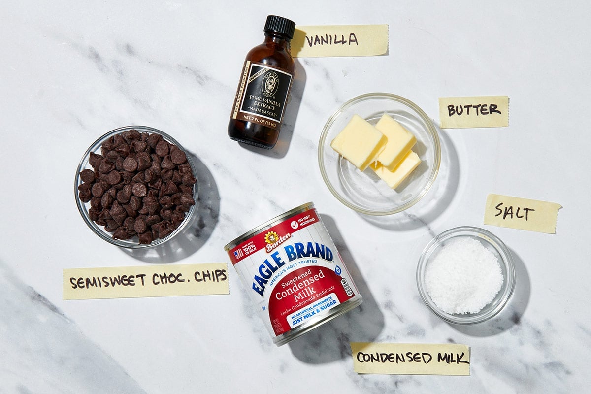 Chocolate chips, vanilla, and condensed milk fudge ingredients.