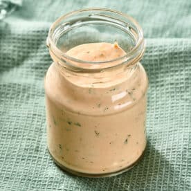 Small glass jar of Remoulade Sauce.