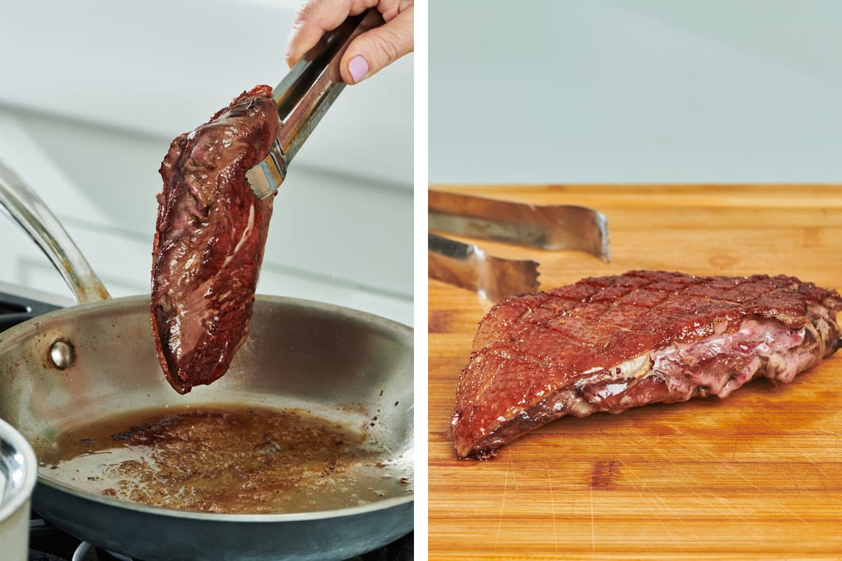 Removing cooked duck breast from pan and letting rest on cutting board.