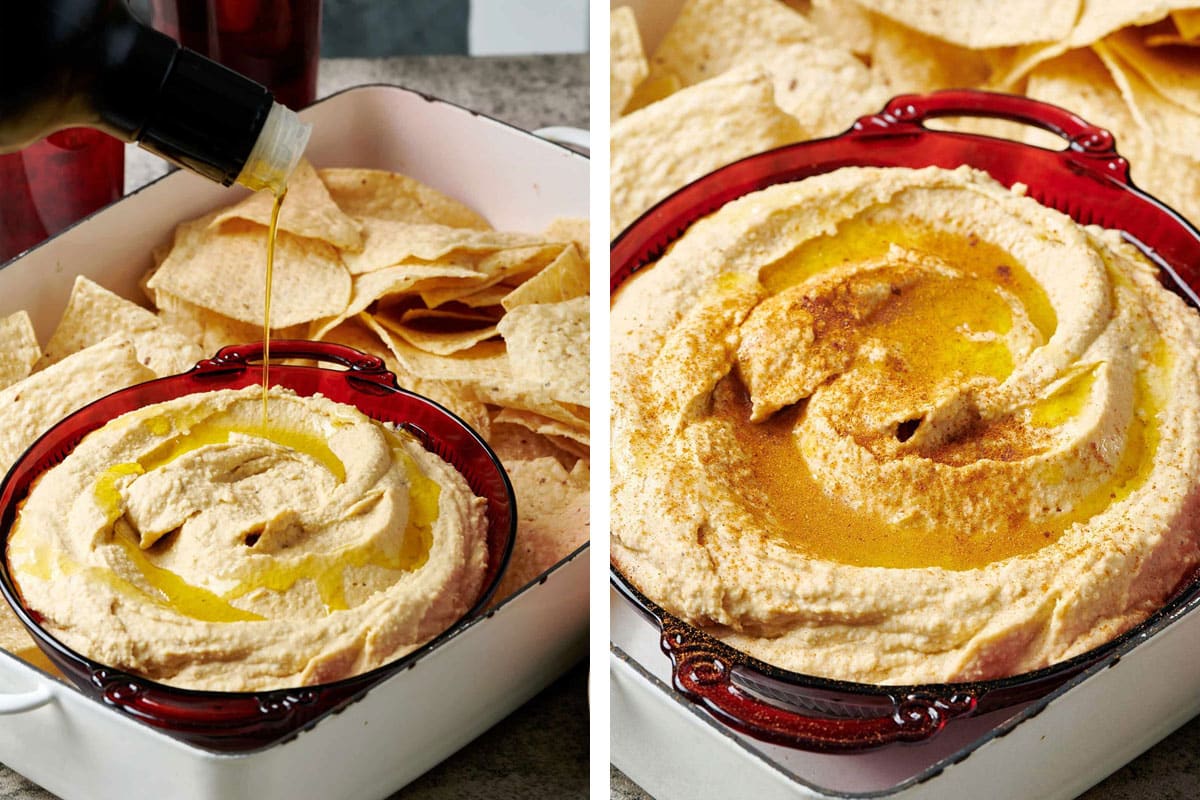 Drizzling olive oil and paprika over homemade hummus in red bowl.
