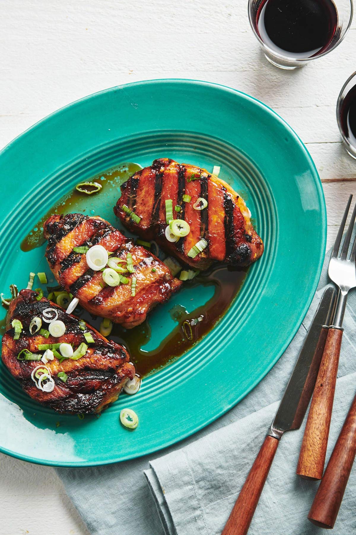 Blue serving platter with Grilled Soy-Ginger Pork Chops.