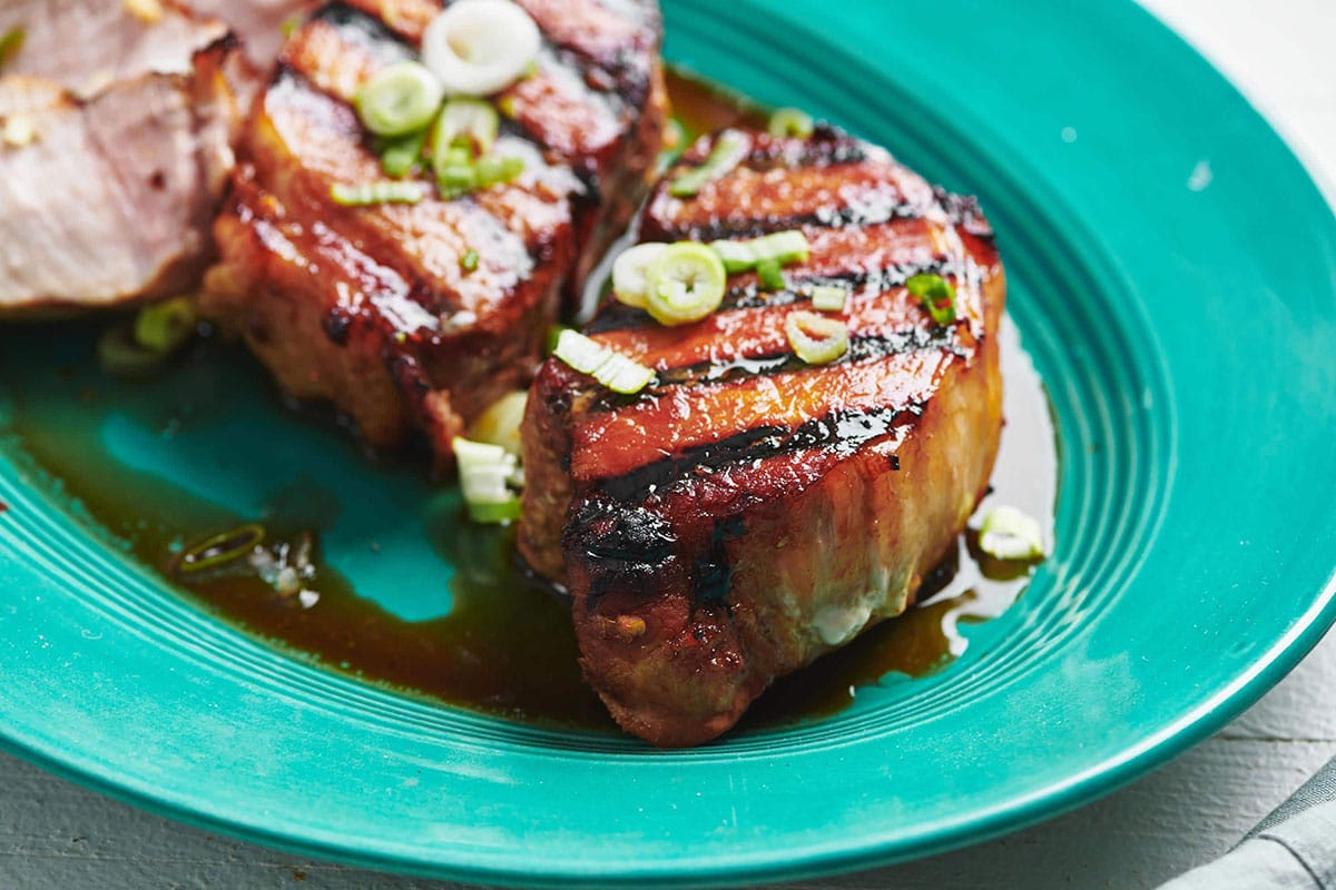 Grilled Soy-Ginger Pork Chops on turquoise plate.