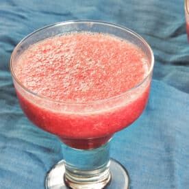 Frozen Prickly Pear Margarita in stemmed glass.