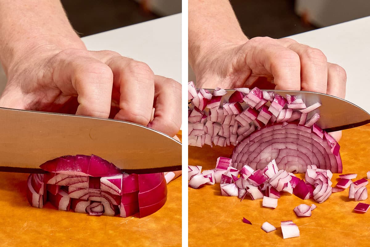 Woman dicing red onion strips on cutting board.