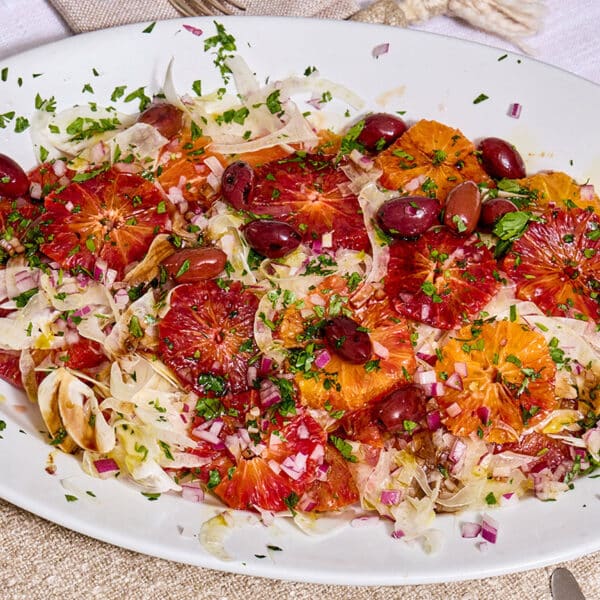 Sicilian orange salad on platter with fennel and parsley.