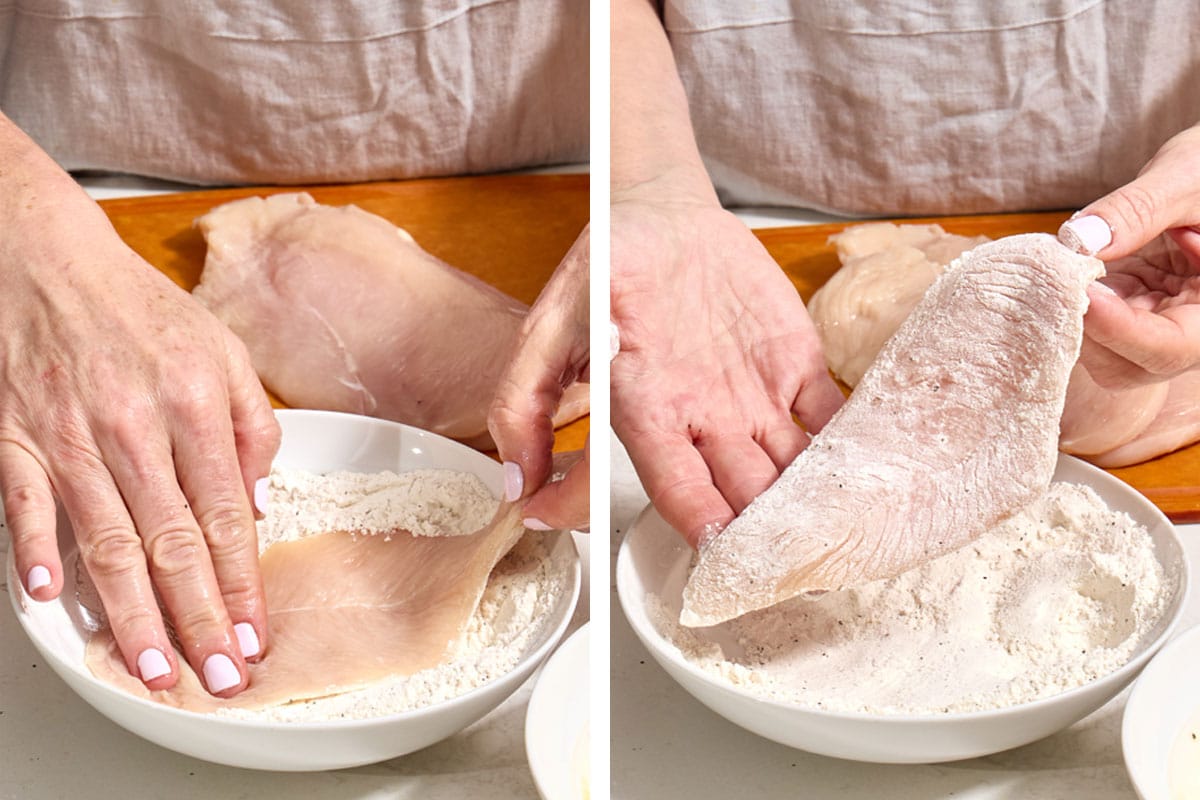 Woman dredging chicken cutlet in seasoned flour.