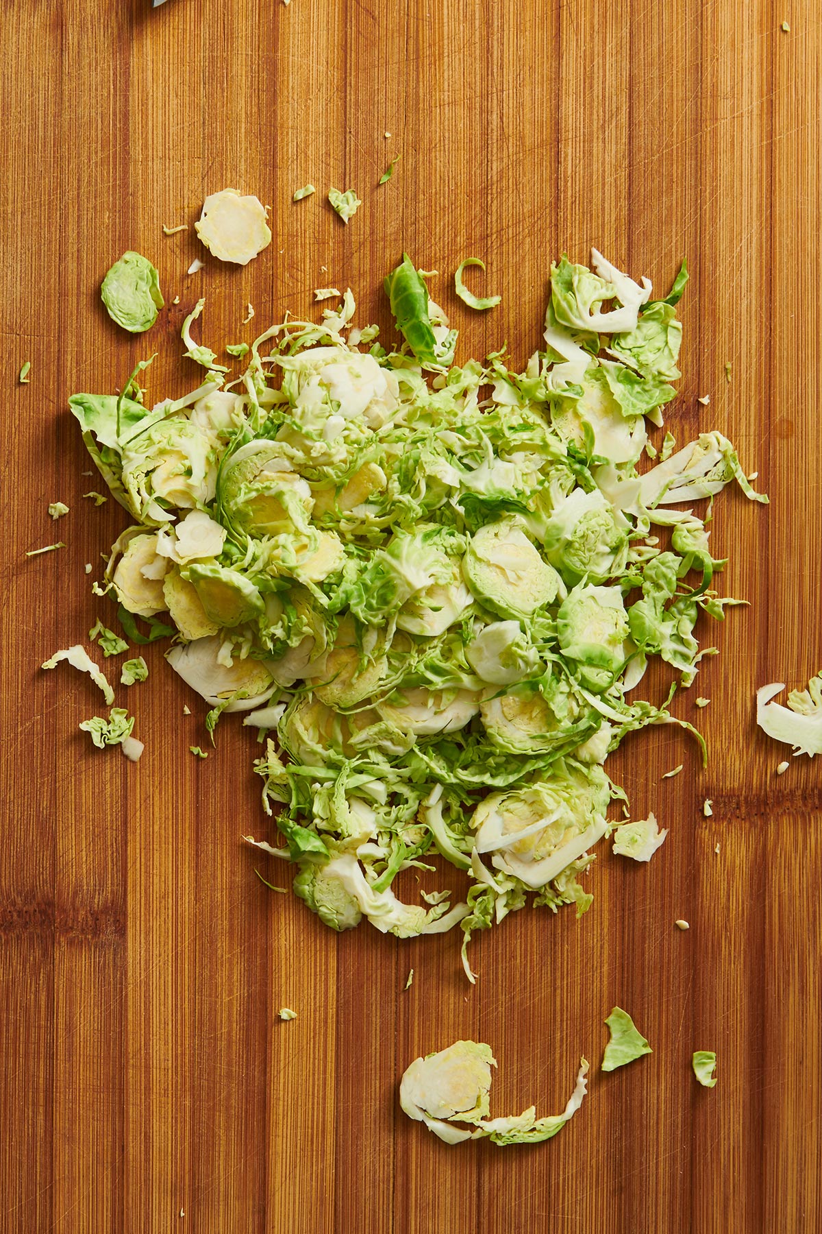 Shredded Brussel sprouts on cutting board.