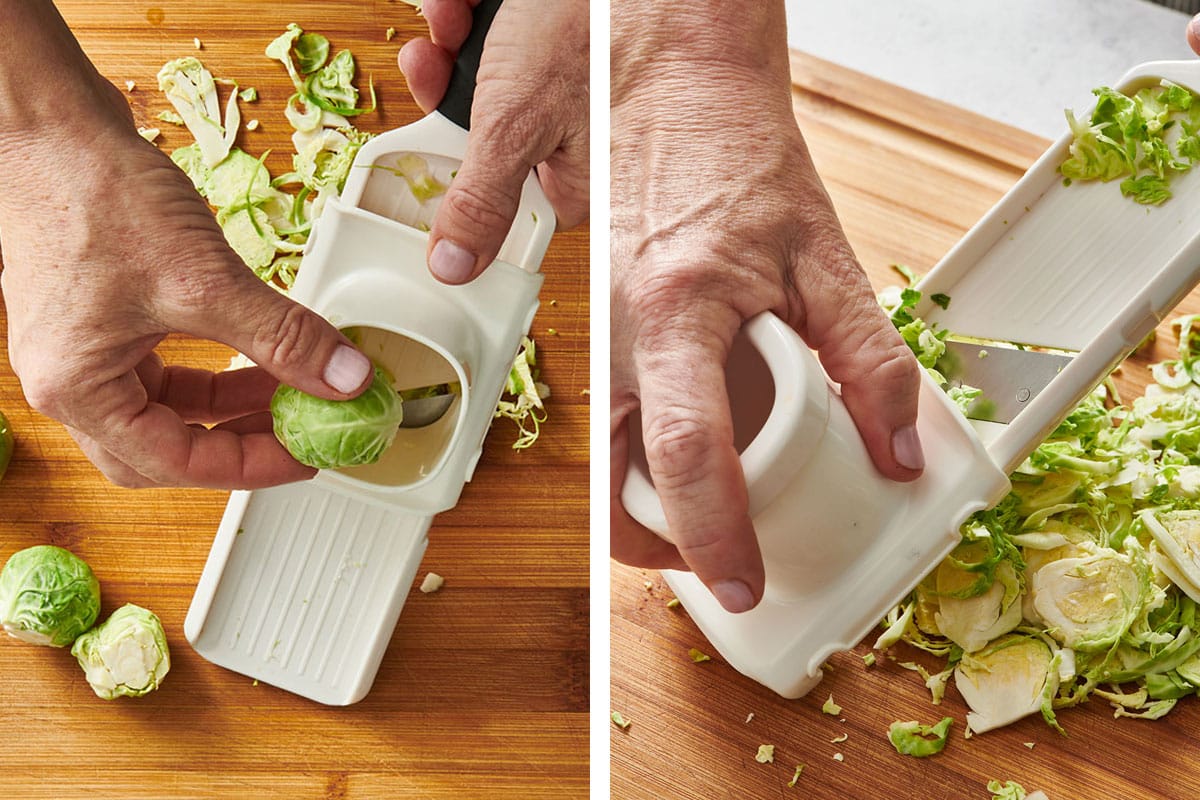 Woman shredding Brussels sprouts with mandoline.