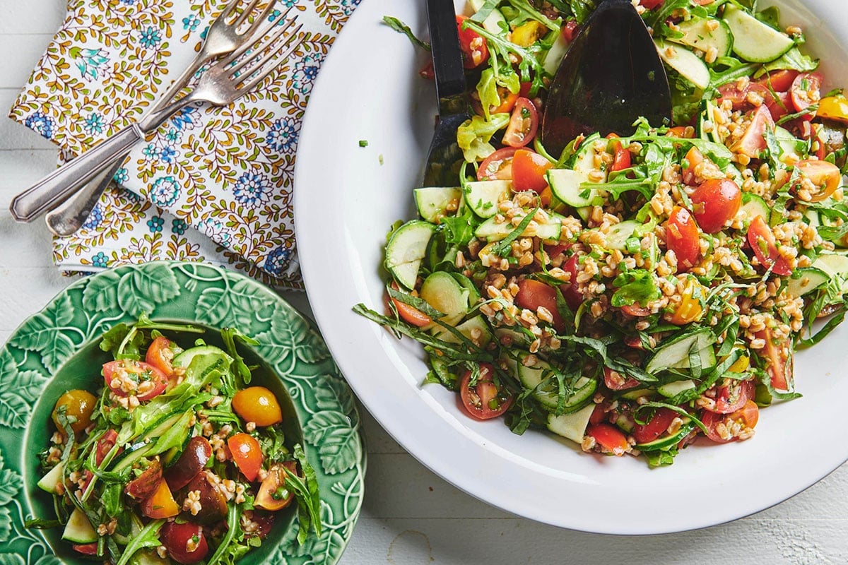 Summer Whole Grain and Vegetable Salad in bowls on table.