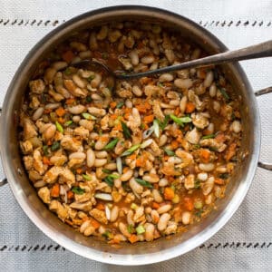 Spoon in a pot of Buffalo Chicken and White Bean Chili.