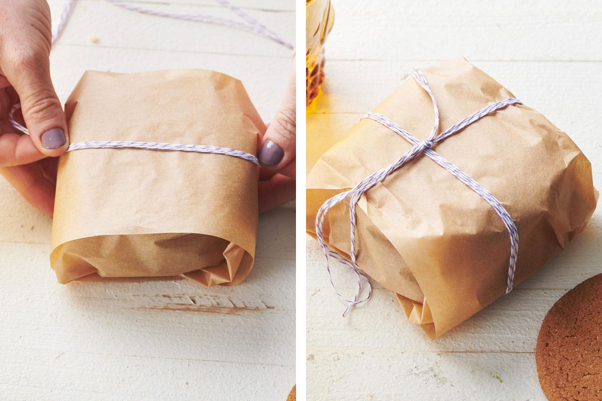 Woman tying twine around Gingersnaps in parchment paper.