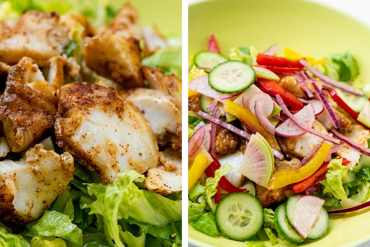 Fried fish over lettuce and topped with fresh vegetables.